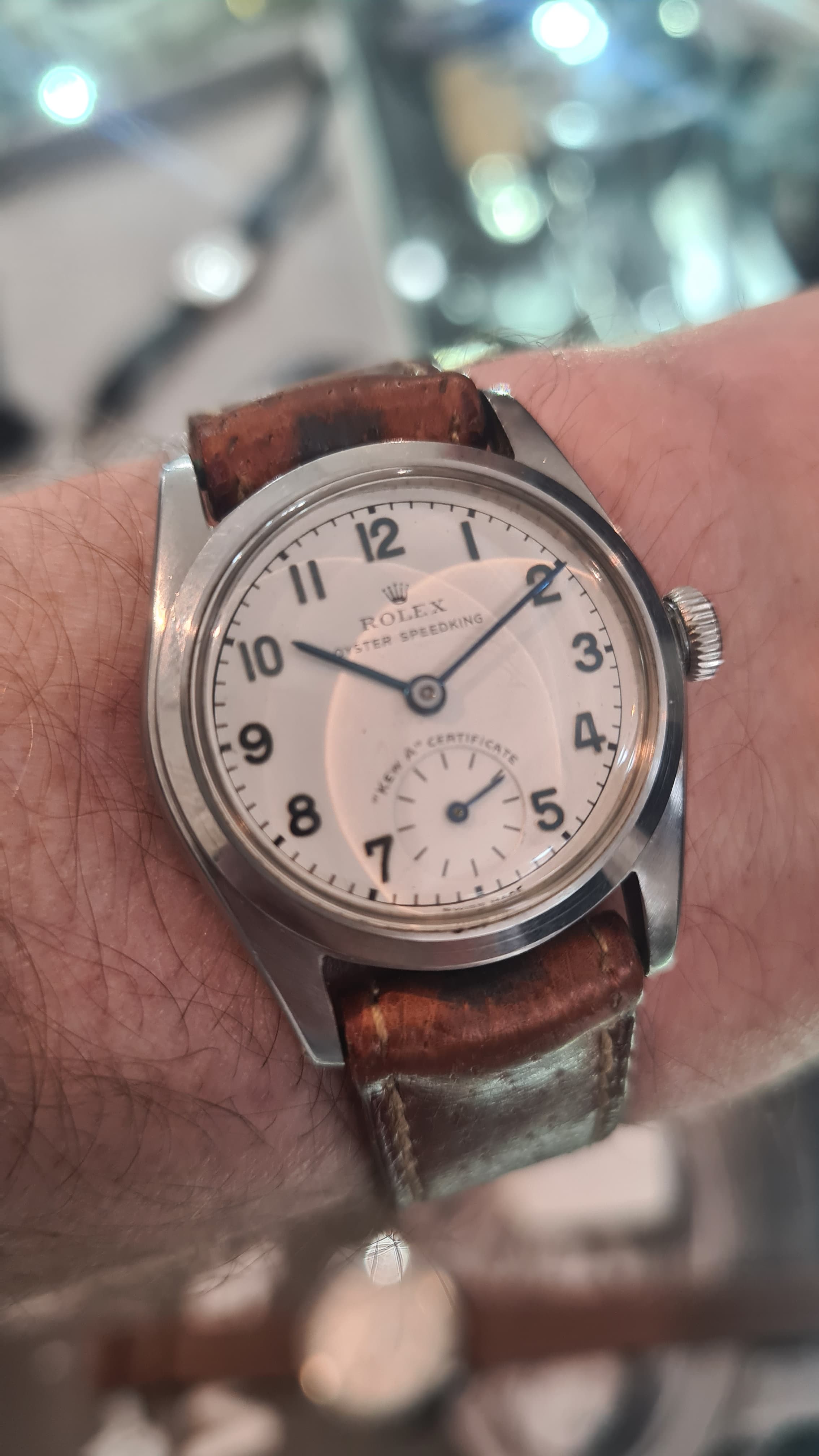 white dialled Kew-A observatory rolex fr with clear black nunmerals and hands, steel case and brwon leather strap