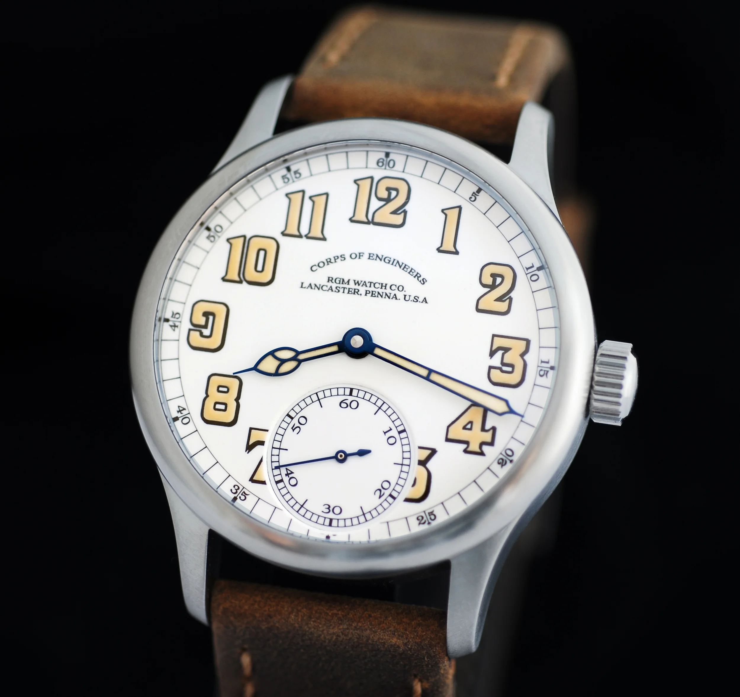 a white RGM Corps of Engineers watch with enamel dial, sell case and large luminous numbers and hands