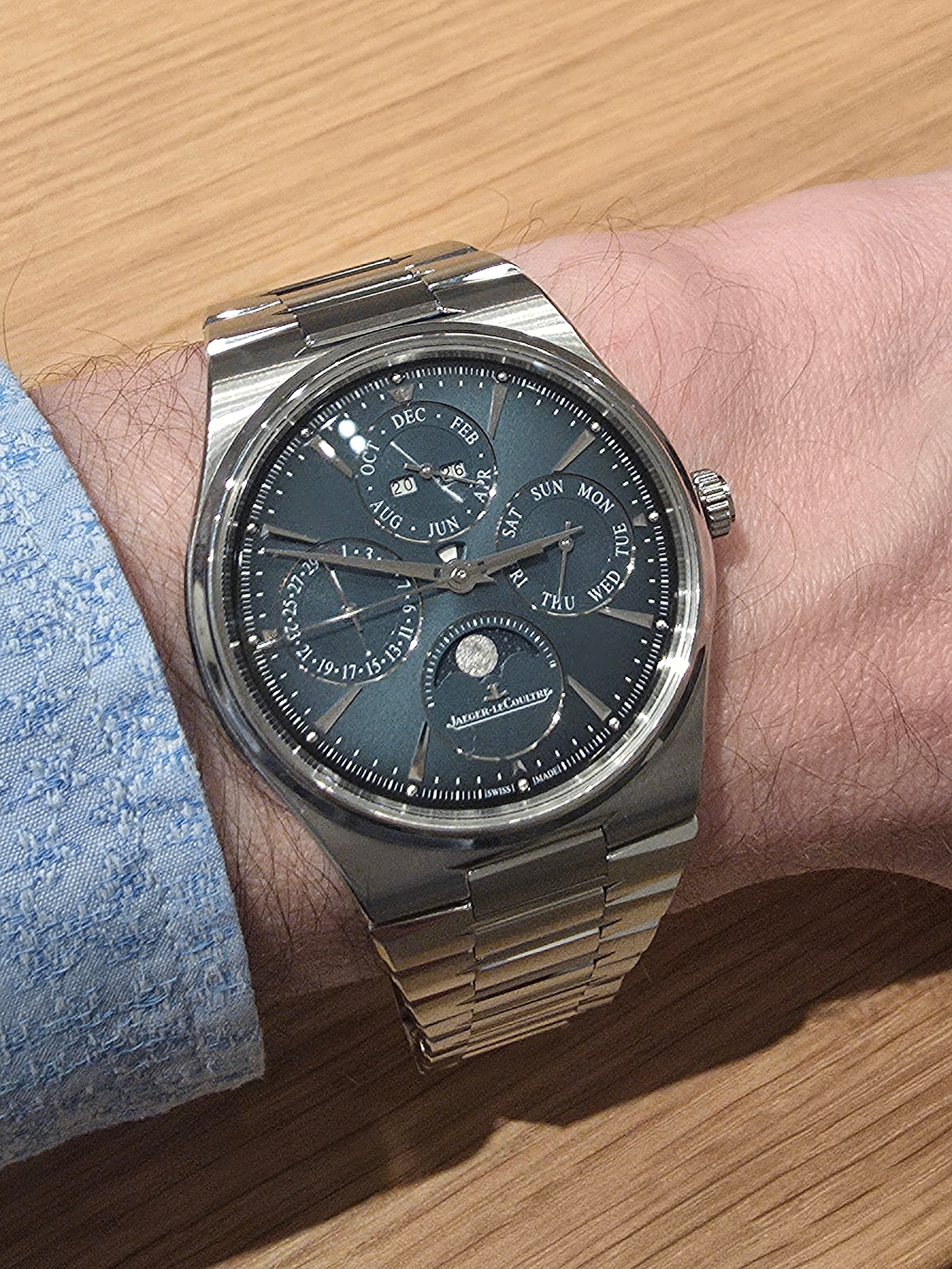 the new Jaeger LeCoultre master control perpetiual calednar in steel with four subdials on an integrated bracelet and a petrol blue dial