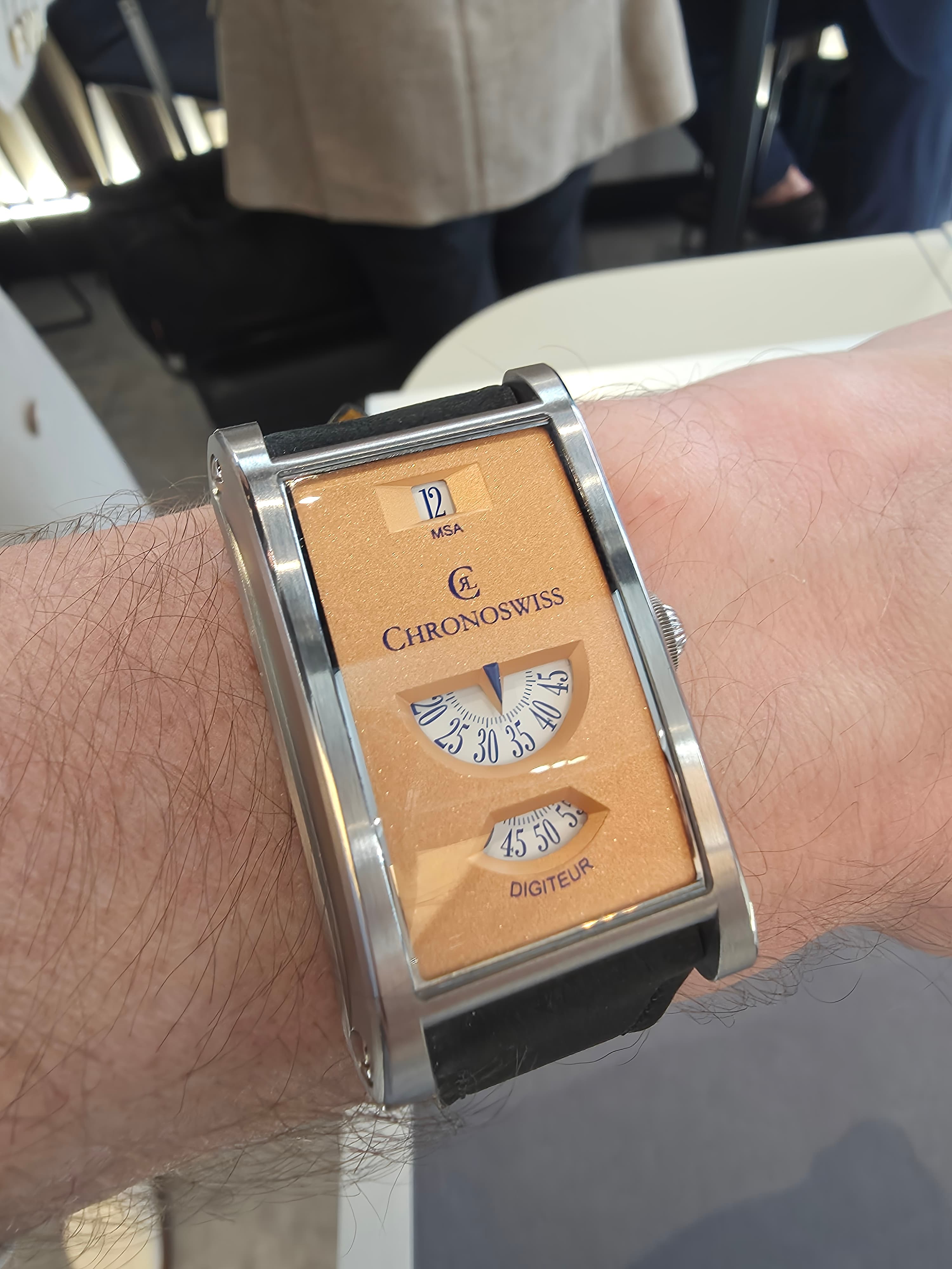 the chronoswiss neo digiteur jump hour watch with rectangular case and sand blasted gold dial