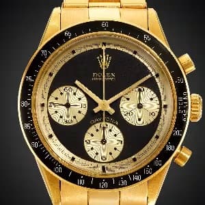 Rolex Daytona "Paul Newman" from the late 1960s in Solud Gold with black dial and Bezel.