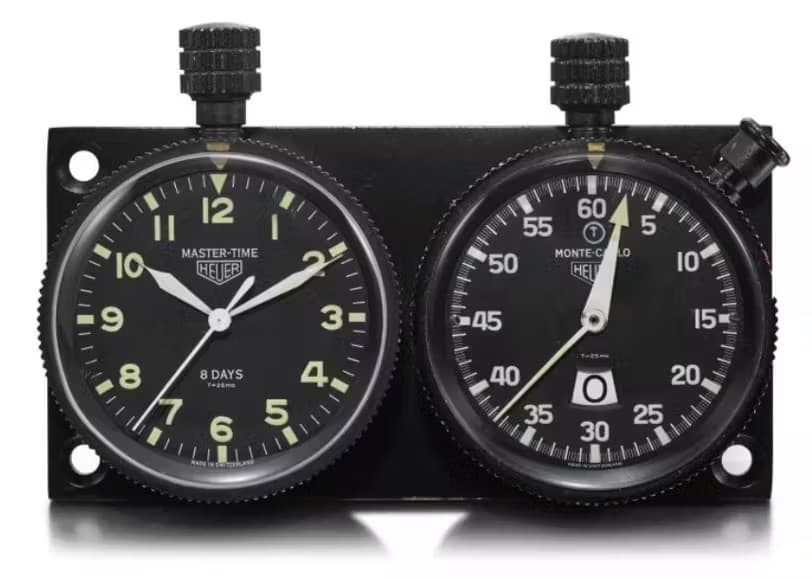 Heuer dashboard timers from the 1970s featuring a clock on the left and a chronograph, or stopwatch on the right. Source: Sothebys.com