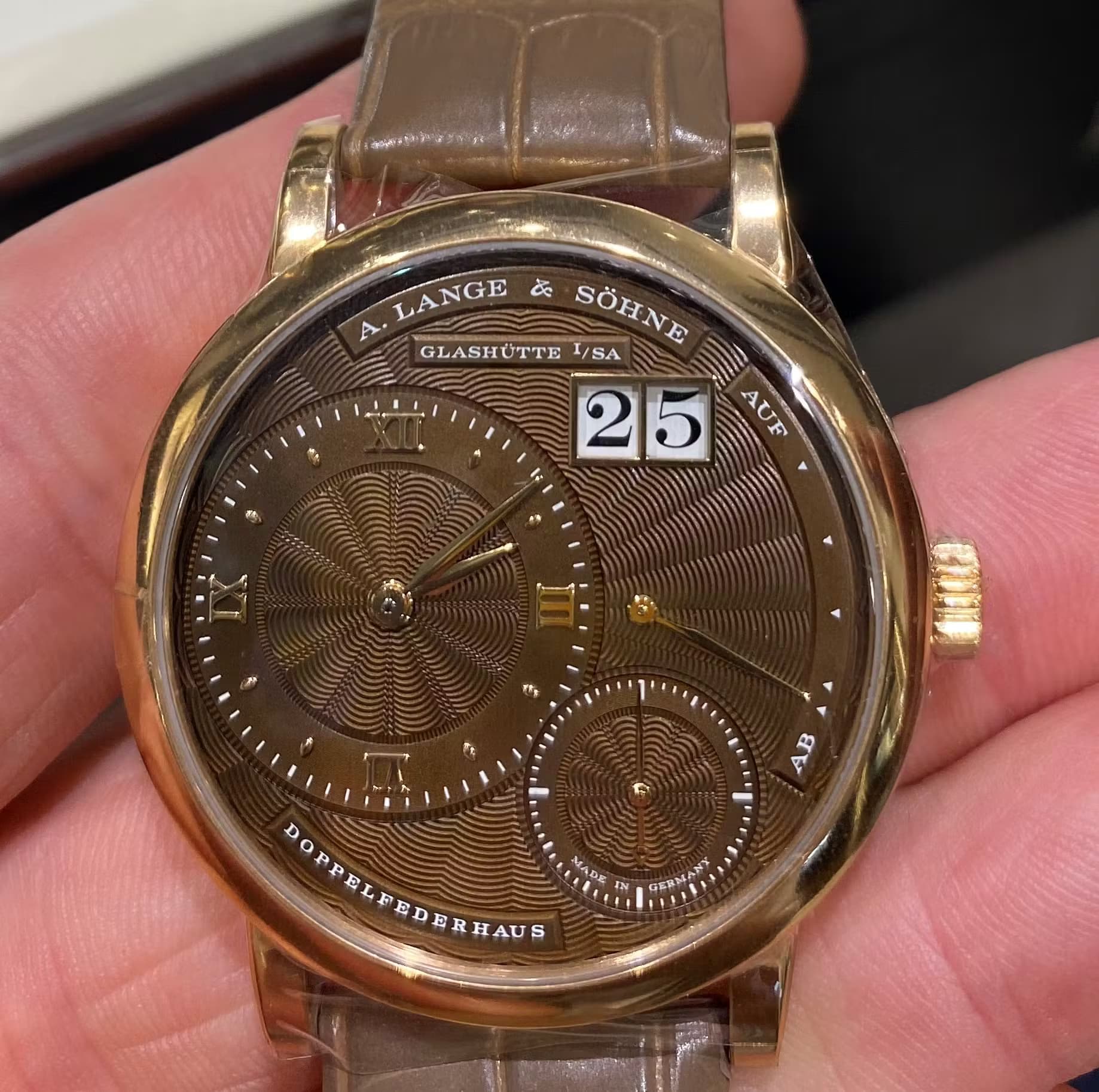This Lange & Sohne watch has an incredible brown gold dial which has been very intricately finished by hand.