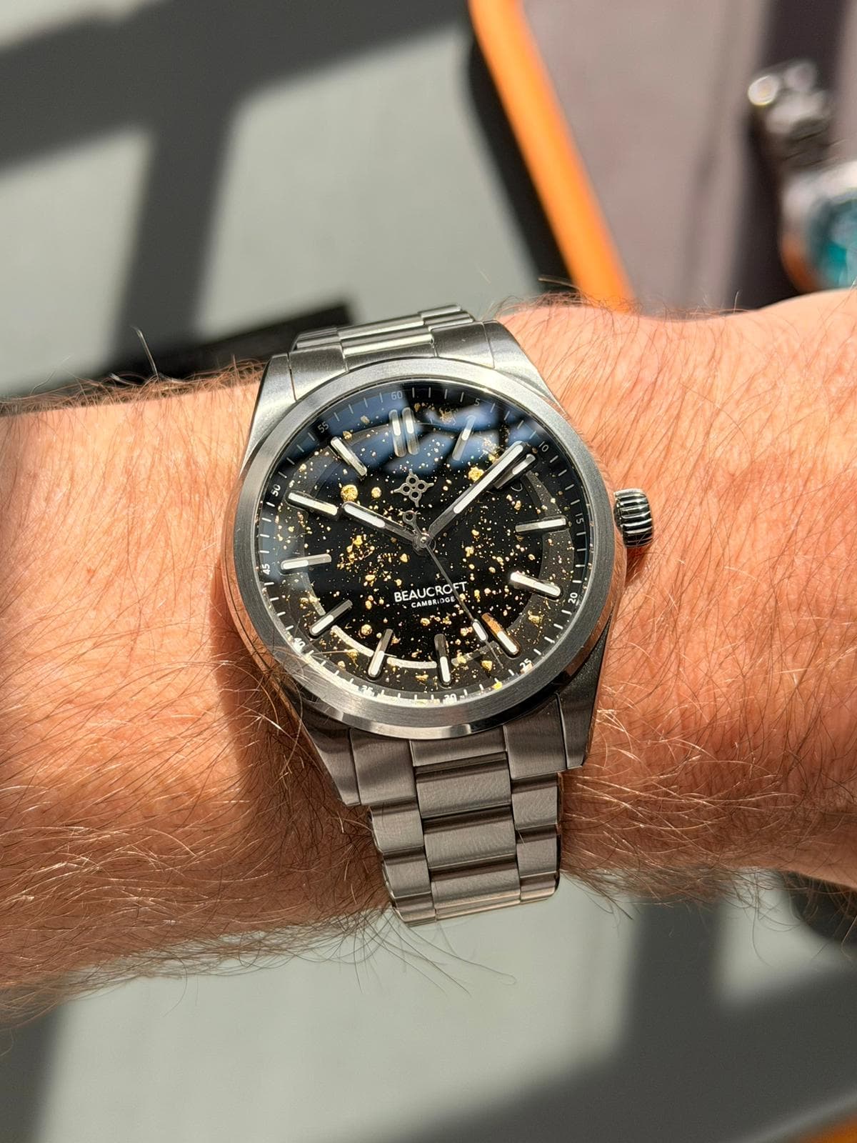 the beaucroft element watch collectors club edition with the dial artist with black dial gold dots gold five index and seconds hand in a steel case and bracelet