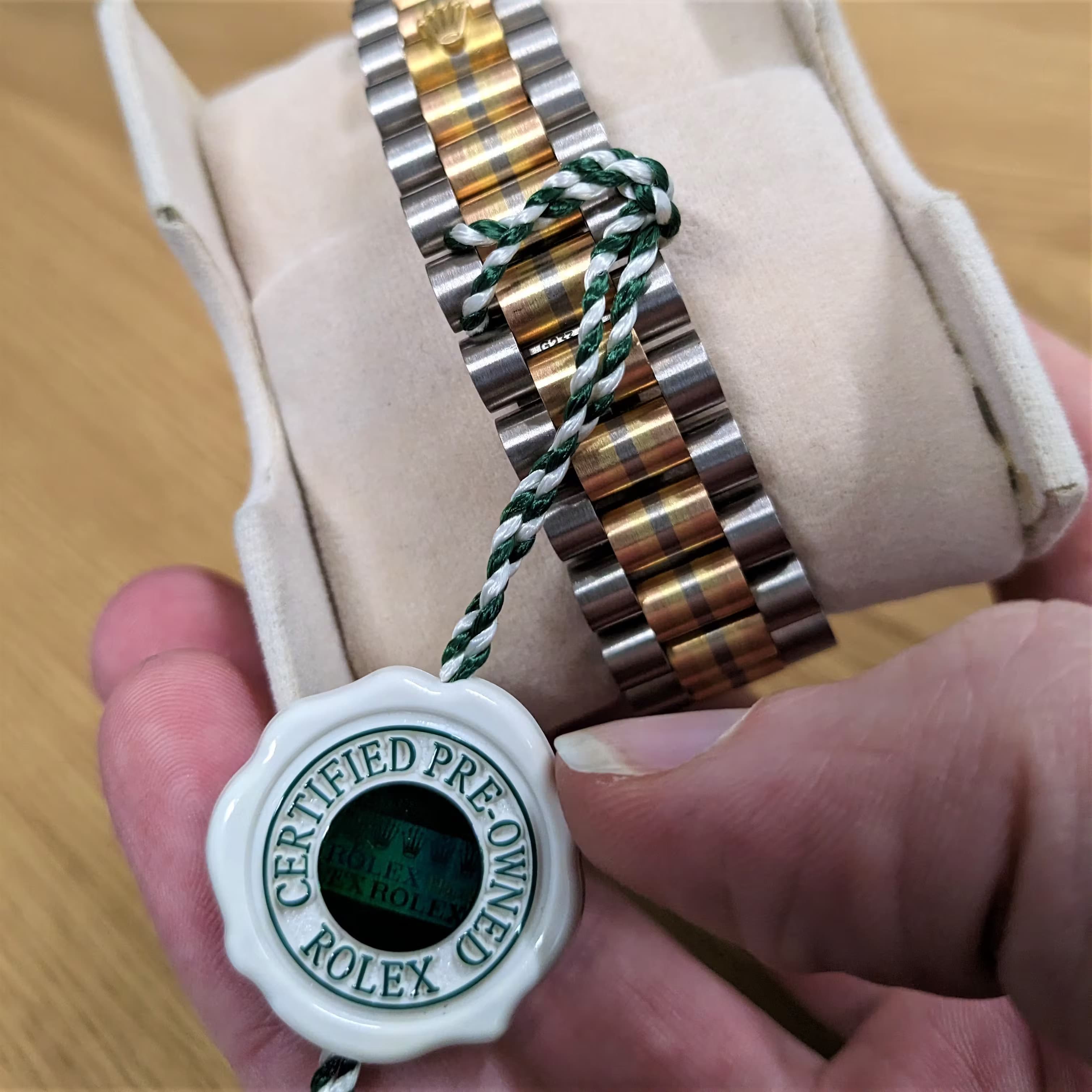A Pre-owned Rolex showing the new tag that Rolex apply to all watches that have gone through their Certified Pre-Owned Scheme. They also come with a new guarantee certificate.