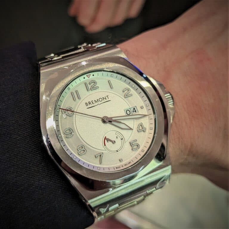 shiny steel bremont supernova sports watch with white dial bold numerlals, six oclock power reserve and date window at 3